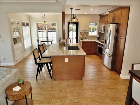 The warm, inviting kitchen offers ample space & every home comfort