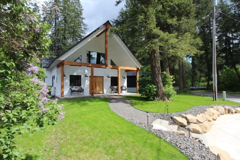 Cozy farm style home in the woods.  Covered front porch with views of the lake!