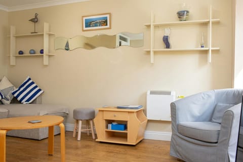 Armchair, coffee table and side table. Electric wall mounted heater