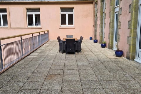 Private back terrace with dining table and BBQ, outside lights