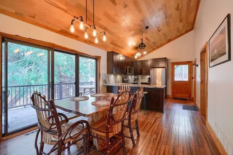 Open kitchen and dining area with breakfast bar