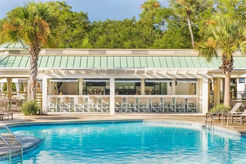 Sip something refreshing at the poolside bar between swims.