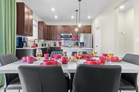 Spacious kitchen equipped with modern stainless steel appliances, perfect for cooking and entertaining.