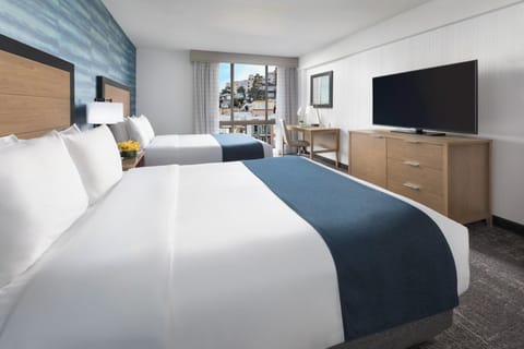 Wake up to sweeping skyline views from your plush bed.