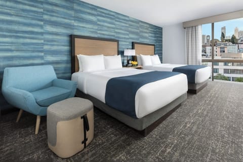 Stretch out in plush comfort while the skyline greets you.