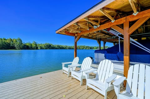 Enjoy stunning lakefront views from this spacious dock with comfortable seating, perfect for relaxing or soaking up the serene atmosphere.