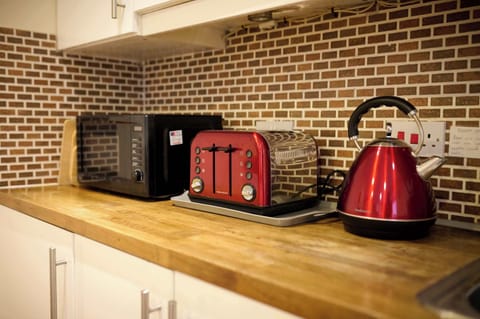 Spacious kitchen with all necessary appliances and cookware to enjoy a home-cooked meal