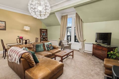 Living space with comfortable seating area, period features and seaviews