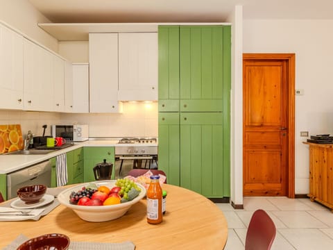 Cabinetry, Food, Tableware, Property, Furniture, Table, Interior Design, Orange, Countertop, Kitchen