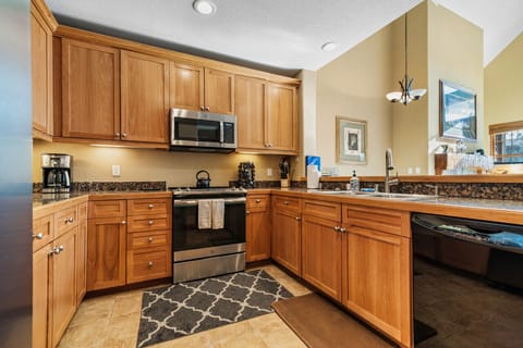 Clean open kitchen with warm lighting