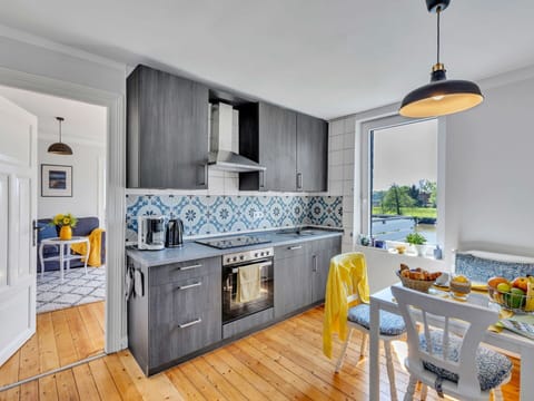 Kitchen, Blue, Countertop, Kitchen Appliance, Interior Design, Major Appliance, Flooring, Furniture, Cabinetry, Floor