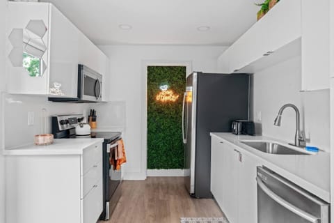 Whip up your favorite meals in this charming kitchen, designed with modern touches.