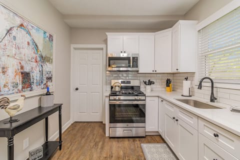 Cook meals in the kitchen which includes nearly any basic cookware you would need: pots & pans, utensils, plates/bowls/cups, blender, mixing bowls, can opener, knives & cutting board