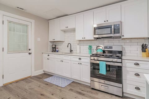 Equipped with the basic needs such as pots and pans, plates, glass, mugs, mixing bowl, spoon and fork, knife block, cutting board, cooking utensils