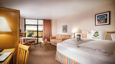 Unwind on crisp linens in a bright, spacious room.