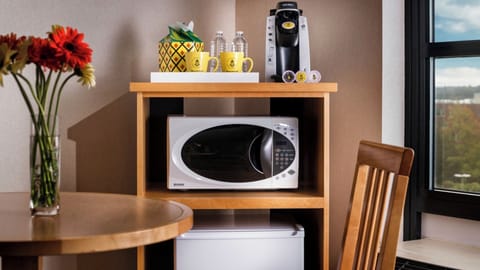Enjoy easy snacks anytime with microwave, fridge, and coffee.