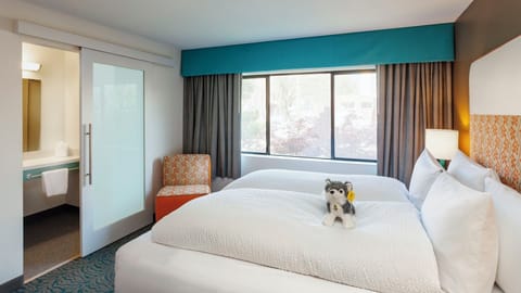 Drift off peacefully in plush bedding beside the sunny window.