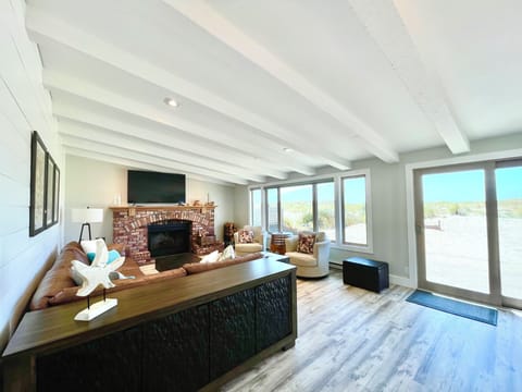 Expansive living with views to the back patio and ocean.