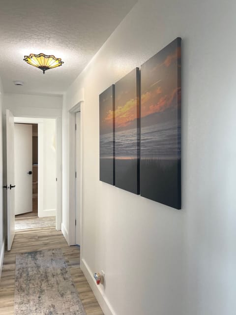 Hallway provides access to bedroom 3 and bathroom 3 across the way.