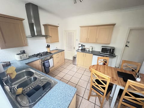 Kitchen / Dining Table, Oven, Stove, Toaster, Microwave, Kettle, Fridge, Freezer