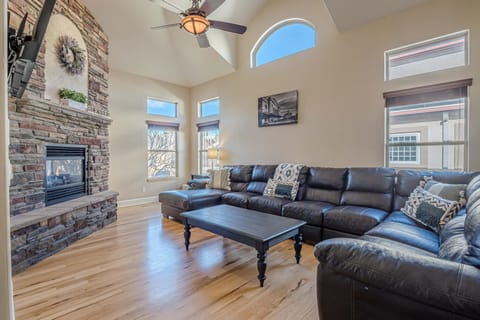 Step into the expansive living area, where high ceilings and an abundance of natural light create an airy and inviting atmosphere.