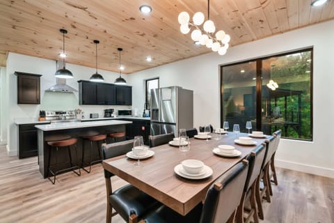 Gather around the elegant table for delightful meals and stunning nature views!