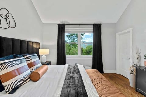 Our master bedroom is designed for both comfort and style, featuring a plush king bed, stylish decor, and abundant natural light.