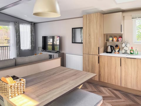 kitchen dinning area | Katie’s Cosy Caravan - Shepherds Holidays, Kilmallieu