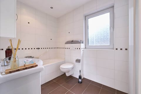 Bathroom with bathtub and walk-in shower