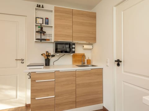 Cabinetry, Furniture, Wood, Flooring, Countertop, Cupboard, Interior Design, Floor, Drawer, Kitchen