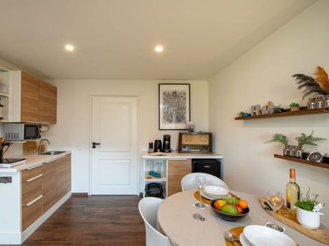 Furniture, Interior Design, Countertop, Kitchen, Flooring, Kitchen Appliance, Wall, Wood, Cabinetry, Major Appliance