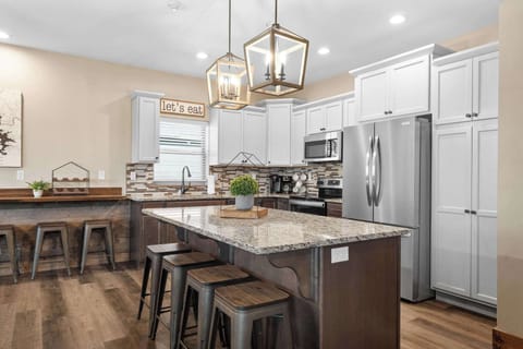 The large kitchen island is perfect for prepping and serving meals for your whole group!