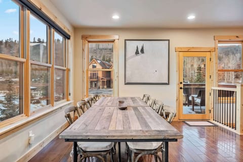 Dining Room: 7-person dining table, connected to kitchen and living room