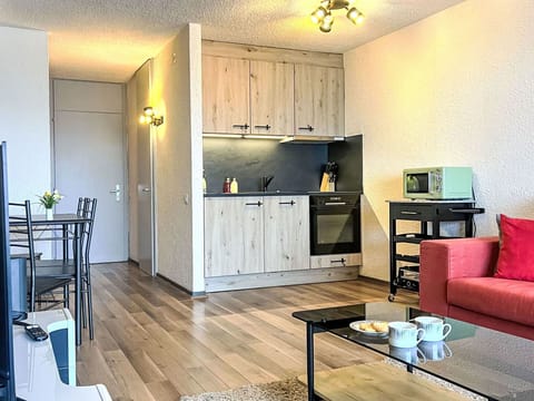 Furniture, Cabinetry, Countertop, Table, Interior Design, Couch, Wood, Lighting, Flooring, Floor