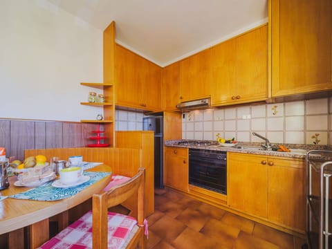 Cabinetry, Property, Furniture, Countertop, Kitchen Sink, Wood, Kitchen, Kitchen Stove, Orange, Sink