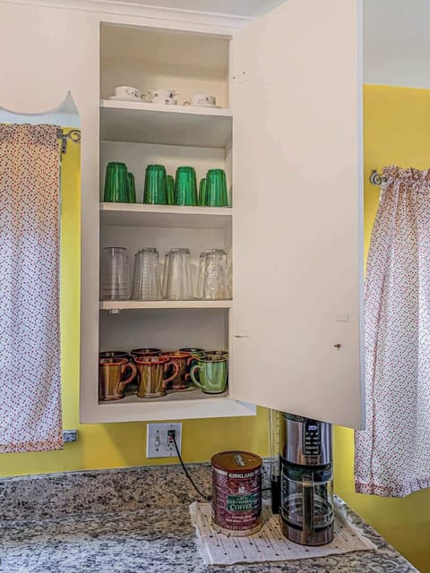 The kitchen is fully stocked with a complete set of glasses, ensuring you have everything needed for any beverage of your choice.