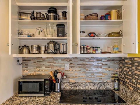 The kitchen is fully equipped with all your cooking essentials, including cookware, utensils, and appliances, making meal preparation easy and convenient.