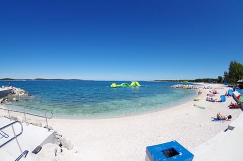 Beach nearby, sun loungers