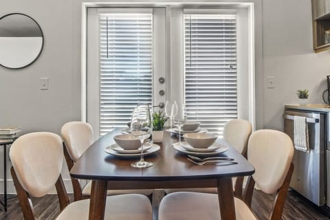 Elegant dining area with a large table and comfortable seating, perfect for gathering with family and friends for a meal.