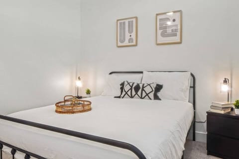 The bedroom offers a luxurious retreat, with a bed that promises restful nights and a room that feels like a private oasis.