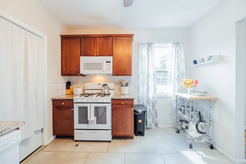 Kitchen with a complete set of cooking essentials.