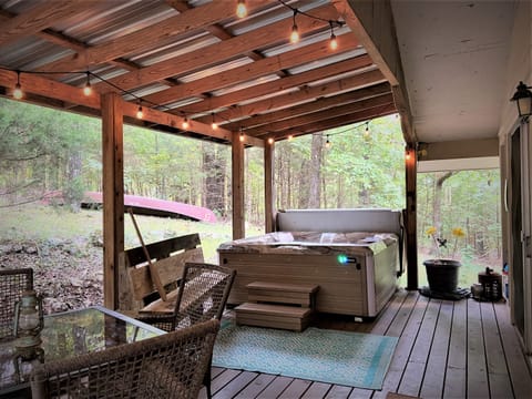Soak in the 4-person hot tub on the tin-roofed back porch