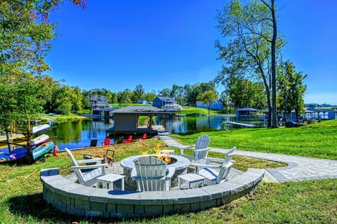 Unwind by the lakeside fire pit, surrounded by stunning water views and outdoor amenities for a perfect retreat.