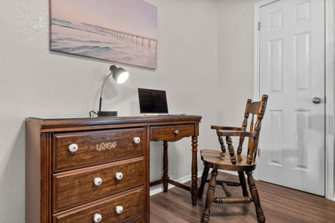 One of the bedrooms has a dedicated workspace.