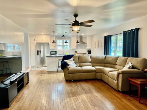 Open concept living room / kitchen. There is large island with 2 bar stools for entertaining.