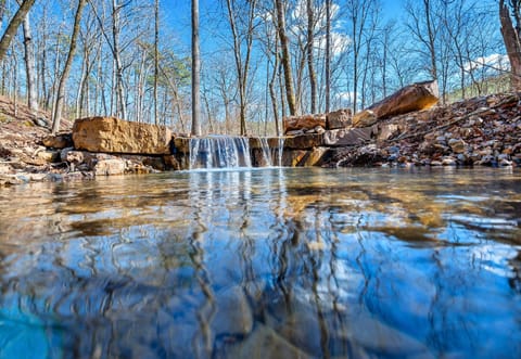 Enjoy the soothing sound of water as it cascades down this beautiful waterfall, adding a touch of serenity to your stay.