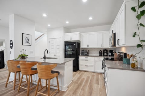 This sleek kitchen features fully equipped appliances, cookware, and dining essentials. Coffee enthusiasts can choose from a traditional coffee maker, a Keurig, or an espresso machine, with pods and supplies provided for the perfect brew.