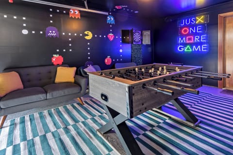 Retro fun! Pac-Man wall, neon lights, and foosball. Let the games begin!