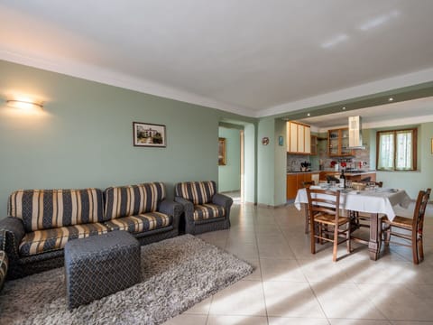 Furniture, Picture Frame, Table, Wood, Building, Couch, Floor, Flooring, Houseplant, Living Room