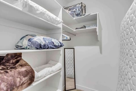 Large master closet with pack and play and extra twin mattress for kids that like to sleep by their parents. Linens included for pack and play and twin mattress. 